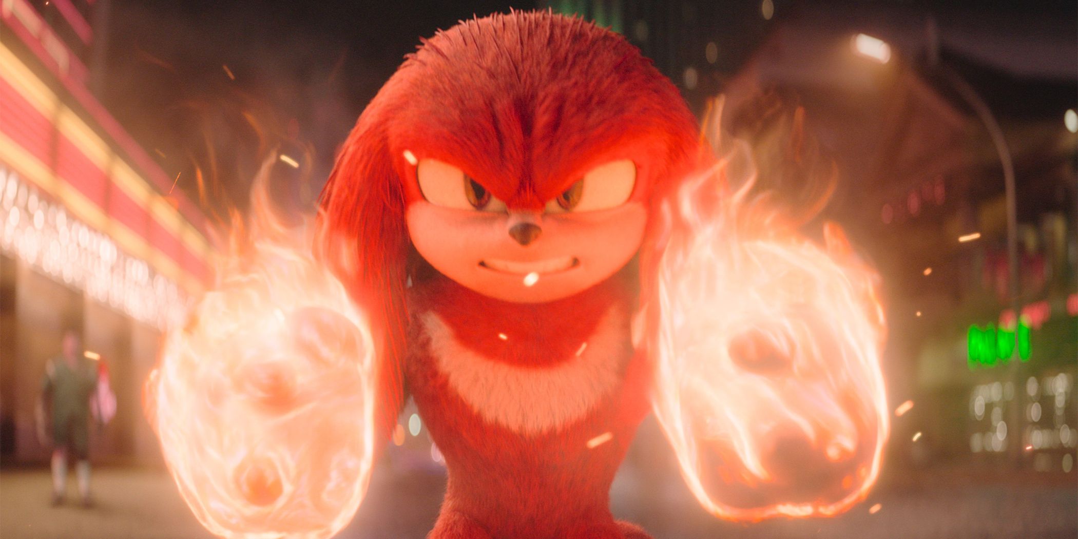 Knuckles scowling with both his fists engulfed in flames on a city street