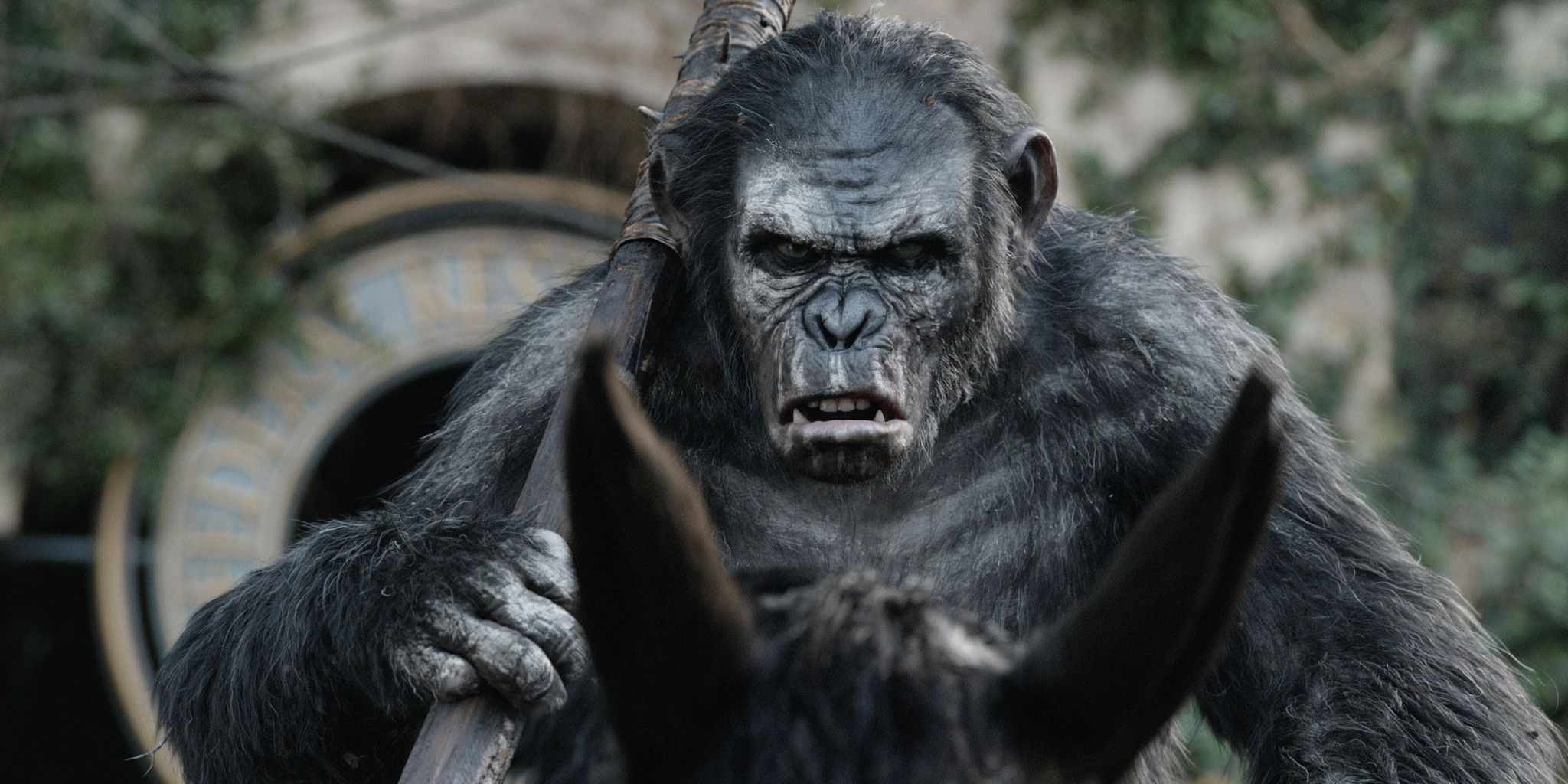 Toby Kebbell as the ape Koba, riding a horse and holding a weapon over his shoulder, looking menacing in &lsquo;Dawn of the Planet of the Apes&rsquo;