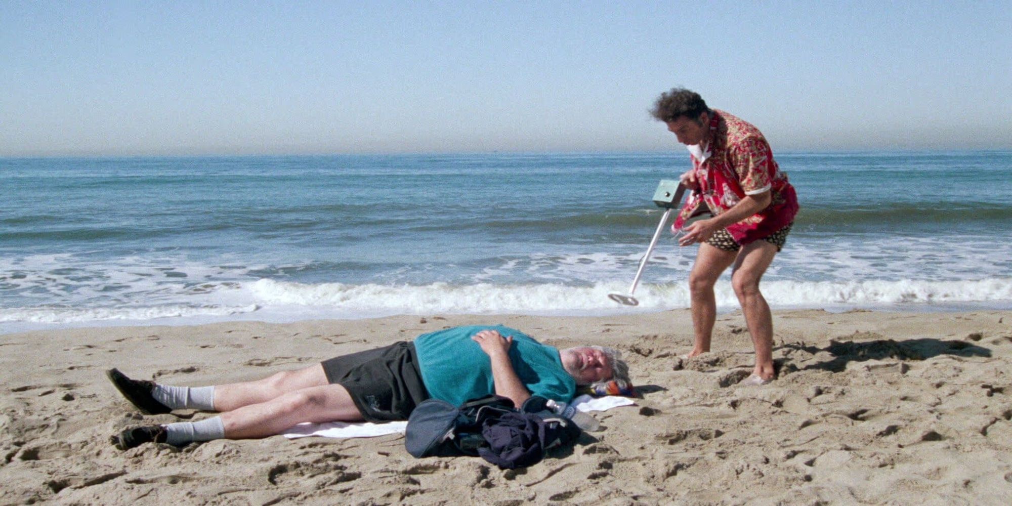 Kramer, played by Michael Richards, encounters a sleeping man on the beach