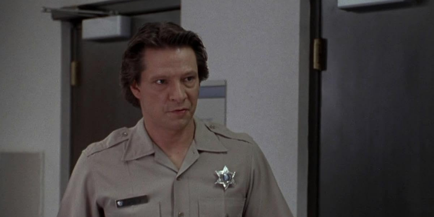 Chris Cooper as Sam Deeds looking at a person offscreen in Lone Star