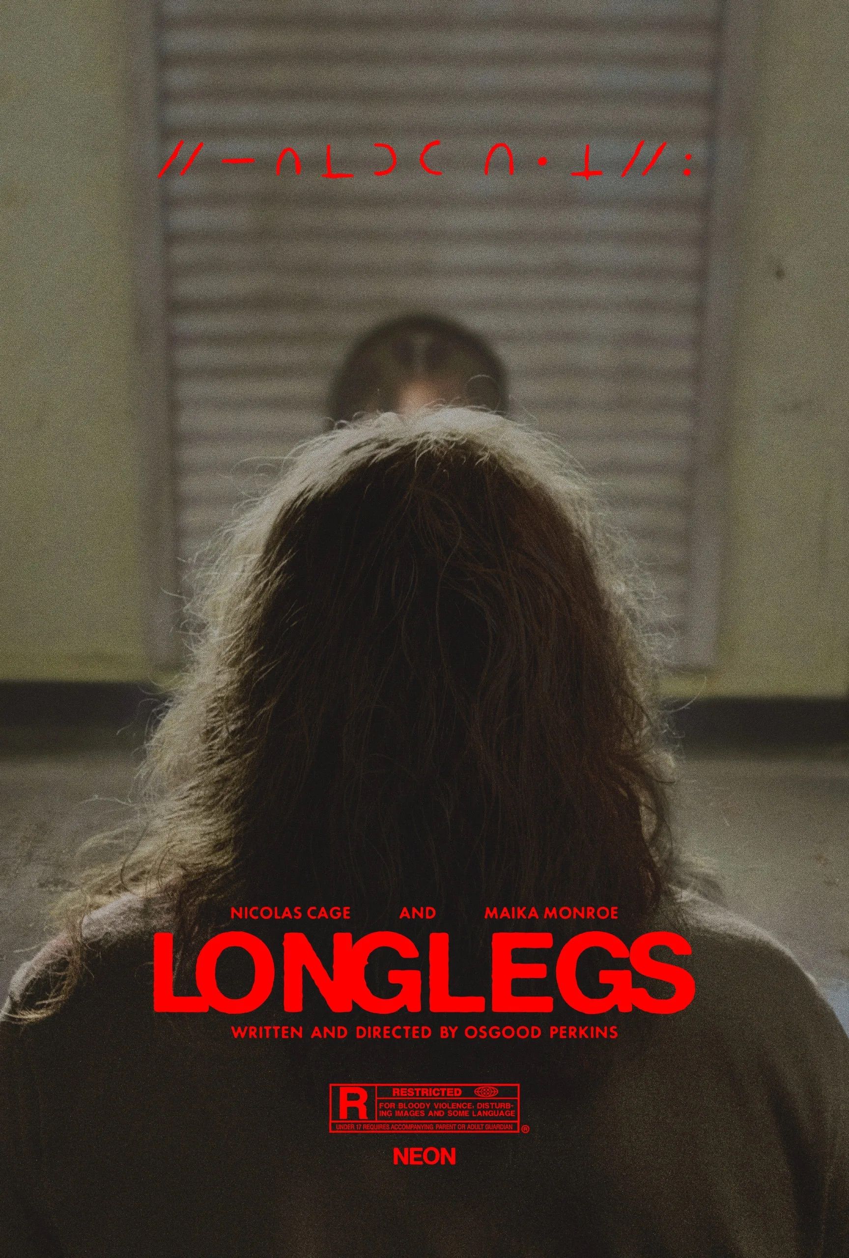 The back of Nicolas Cage's head as he's seated across from a girl on a poster for Longlegs