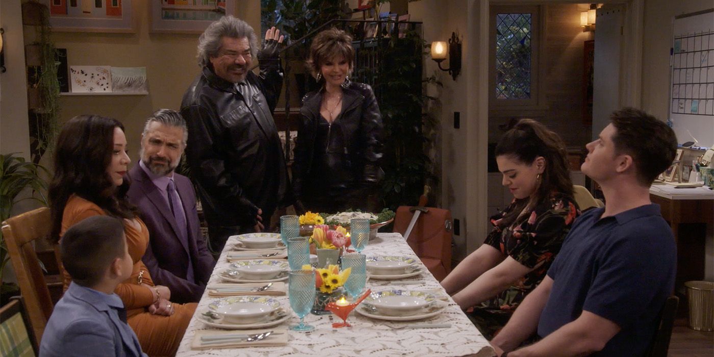 the ensemble cast of Lopez vs Lopez seated around a dinner table in Season 2 Episode 8