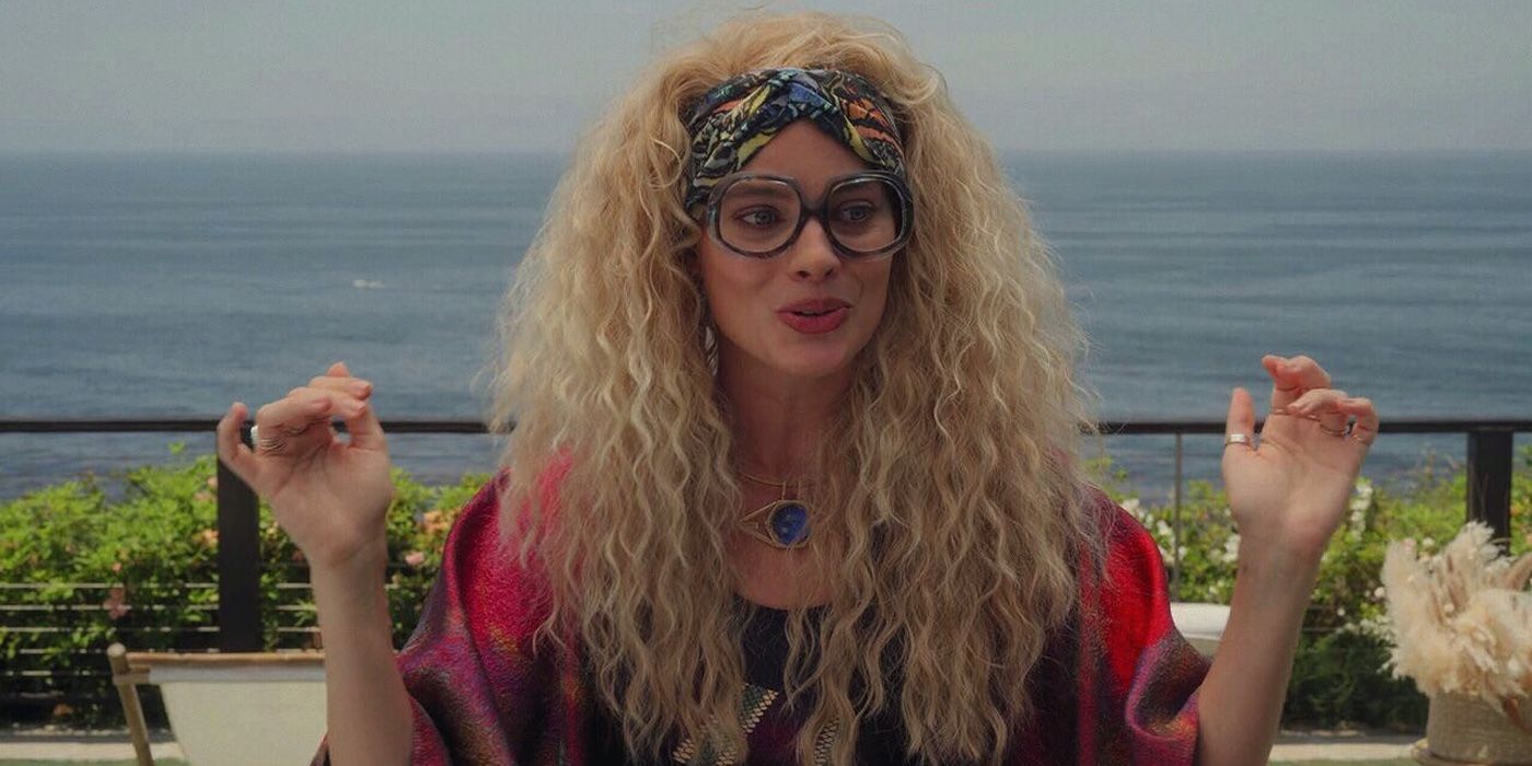 Margot Robbie with voluminous curly hair and coke bottle glasses in her one episode cameo on Hulu's Dollface.