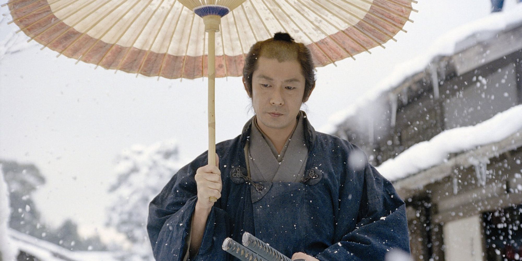 Masatoshi Nagase holding an umbrella in The Hidden Blade (2004)