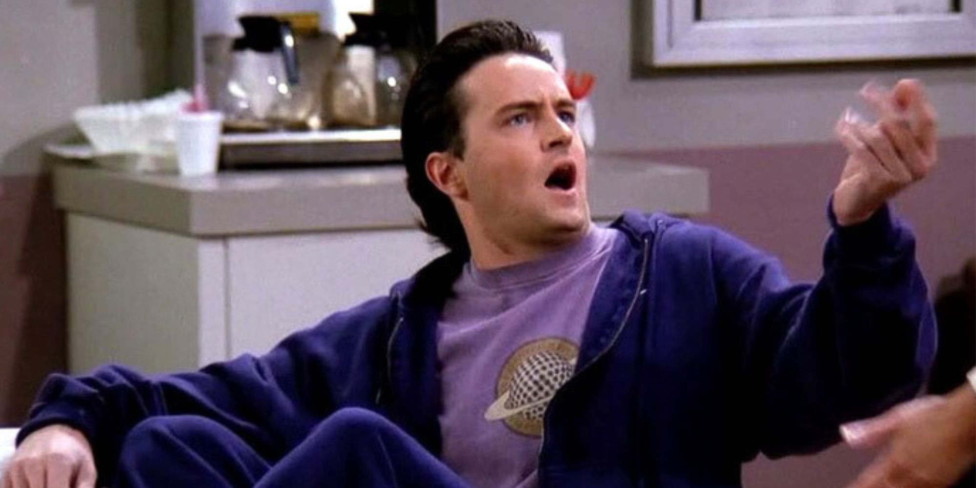 Chandler Bing sitting in a hospital waiting room in Friends