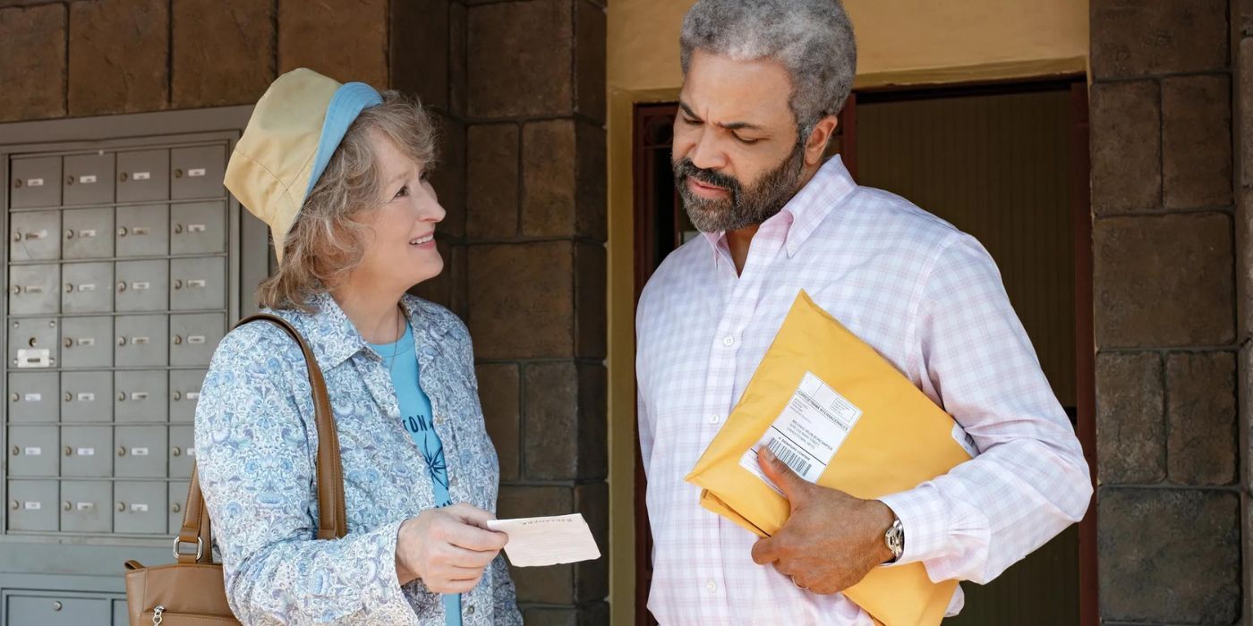 Ellen showing a document to Malchus Irving in The Laundromat