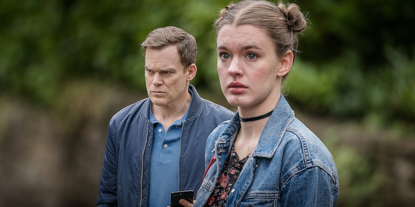 A young girl looking to the distance while a man stands behind her in Safe.