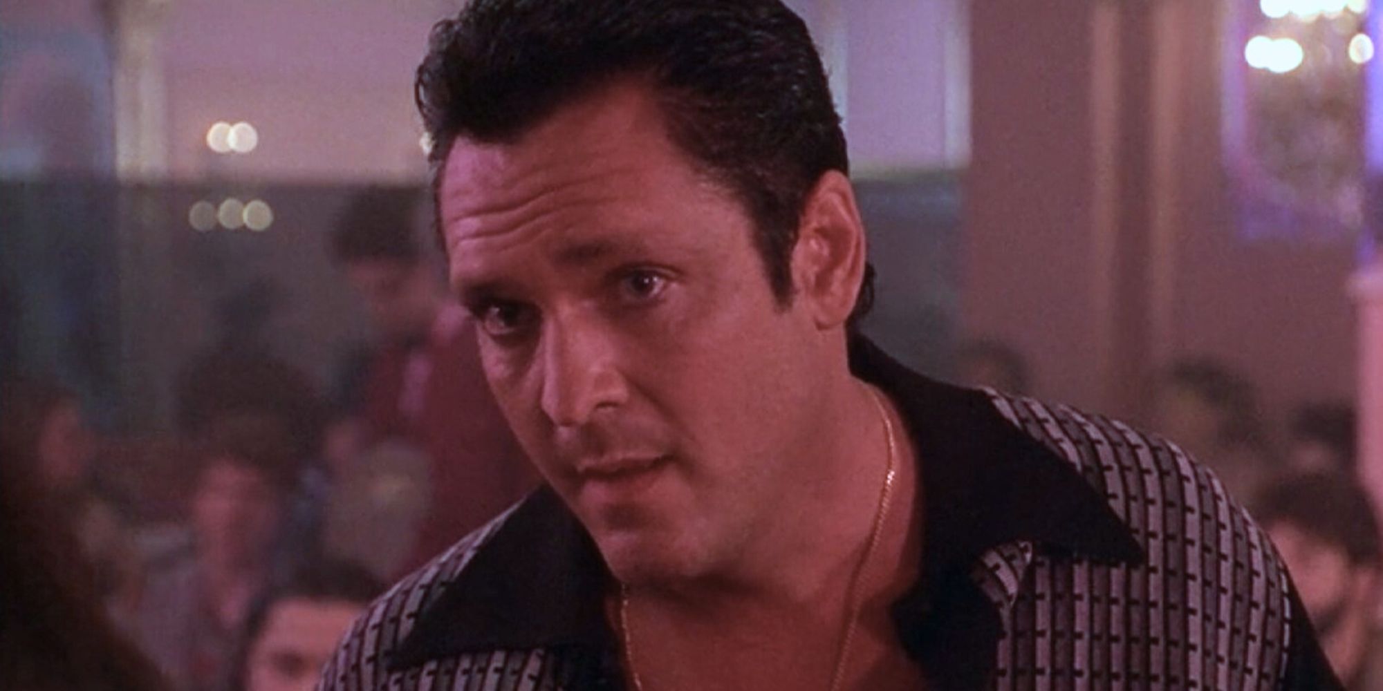 Sonny Black looking intently at someone off-camera in Donnie Brasco (1997)