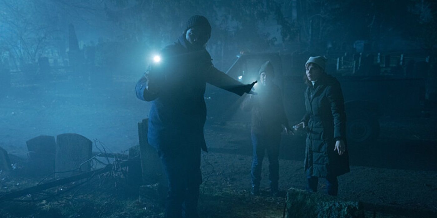 Mike Colter, Aasif Mandvi, and Katja Herbers, searching for something in the dark, as Dr. Kristen Bouchard, Father David Acosta, and Ben Shakir in Evil Season 4