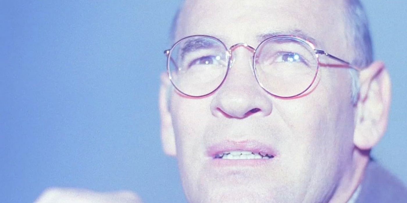 Mitch Pileggi as Skinner looks up at UFO into bright light as it flies away from Requiem in The X-Files.