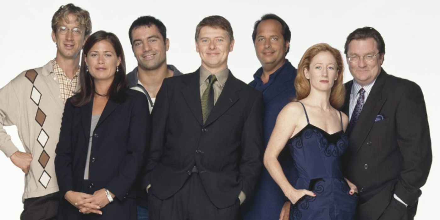 The NewsRadio cast in Season Five with Jon Lovitz.