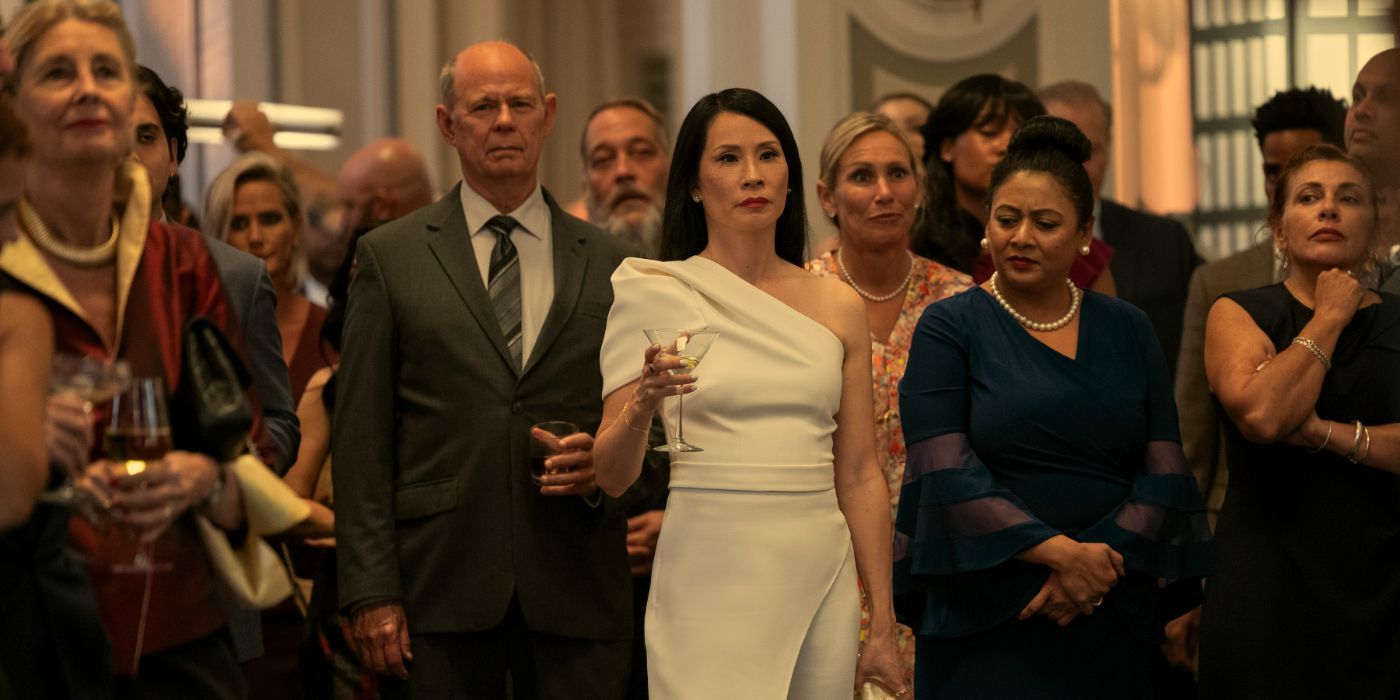Lucy Liu raises a glass at a crowded party in 'A Man in Full'