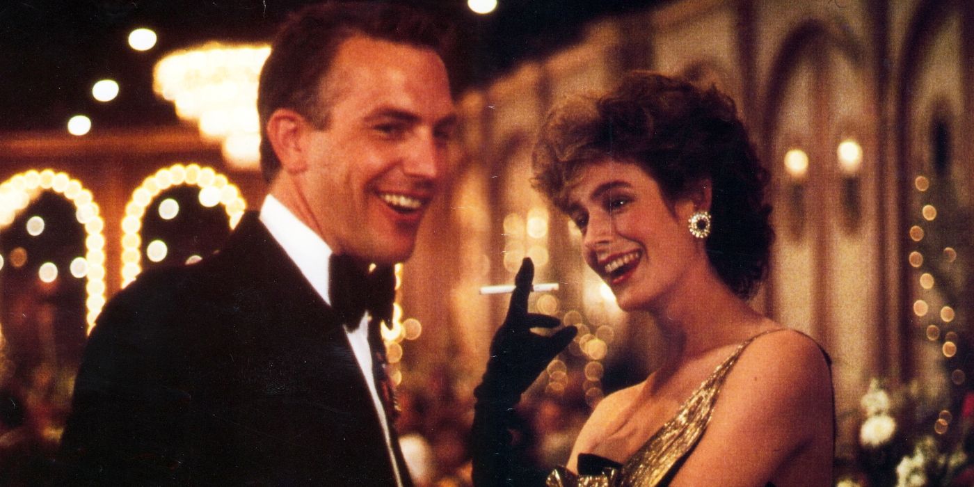 Kevin Coster as Tom Farrell and Sean Young as Susan Atwell laughing together in No Way Out