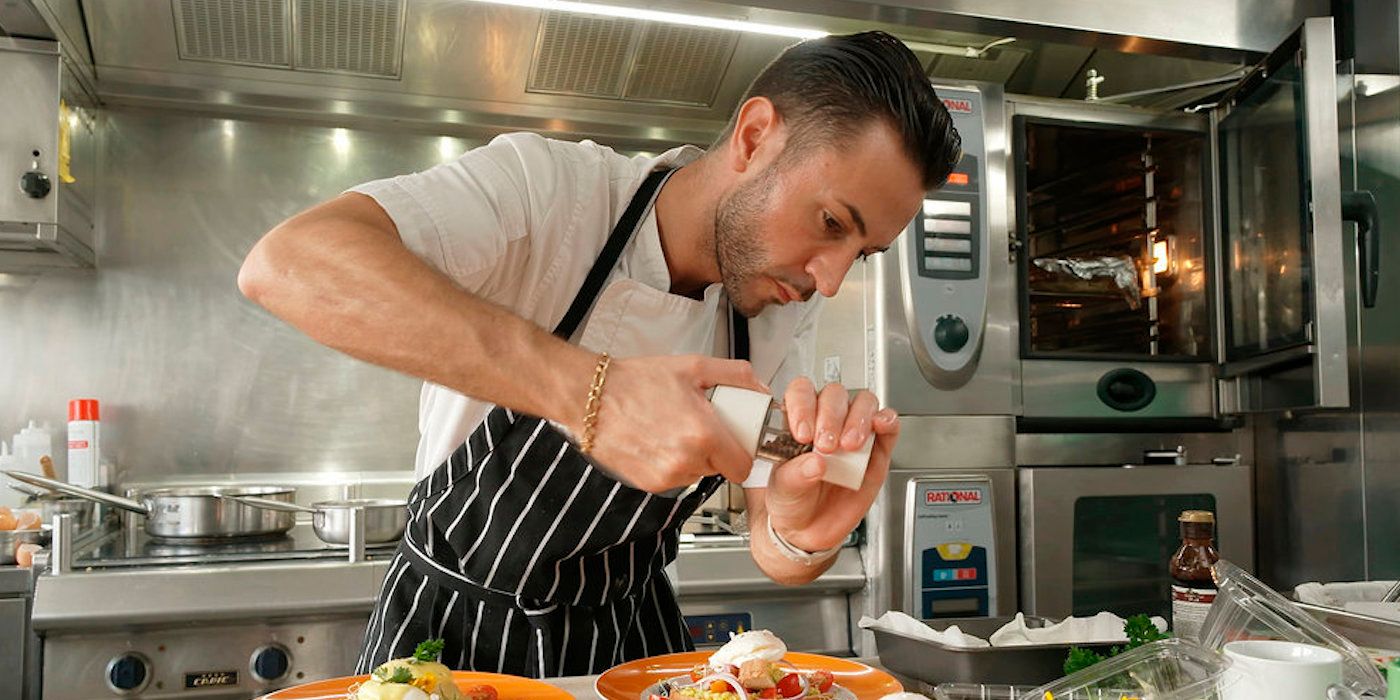 Chef Anthony Iracane adds pepper to a dish on 'Below Deck'