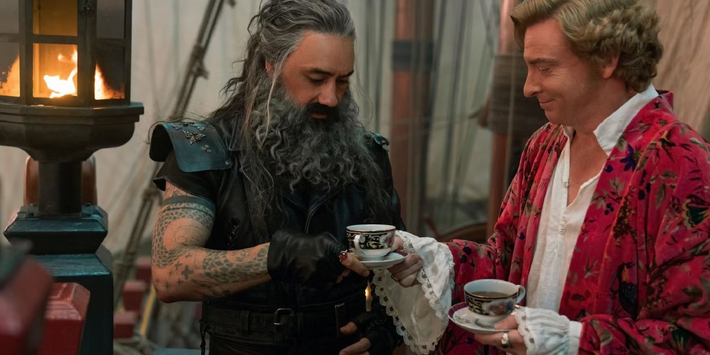 Blackbeard (left), played by Taika Waititi and Stede Bonnet (right), played by Rhys Darby, share a cup of tea