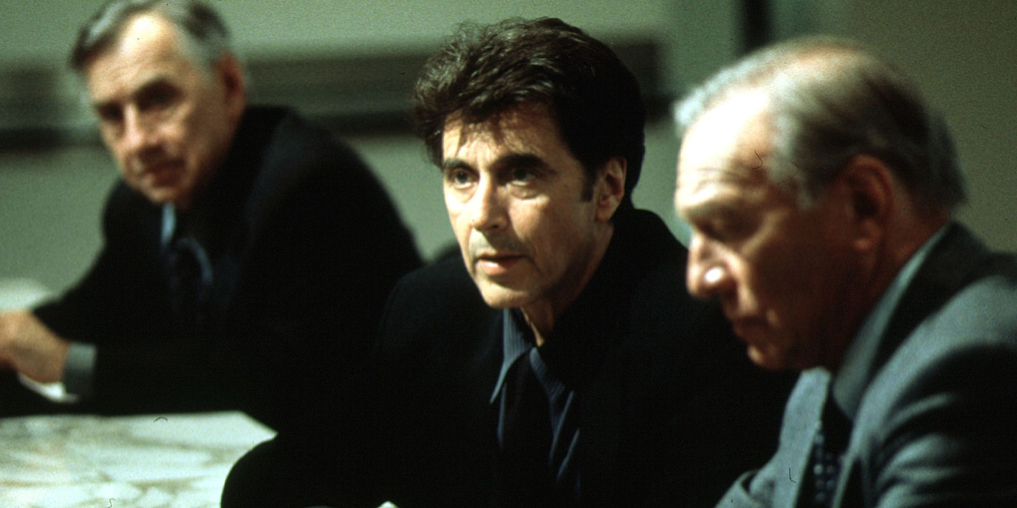 Philip Baker Hall, Al Pacino, and Christopher Plummer sit during a meeting in Michael Mann's 'The Insider'