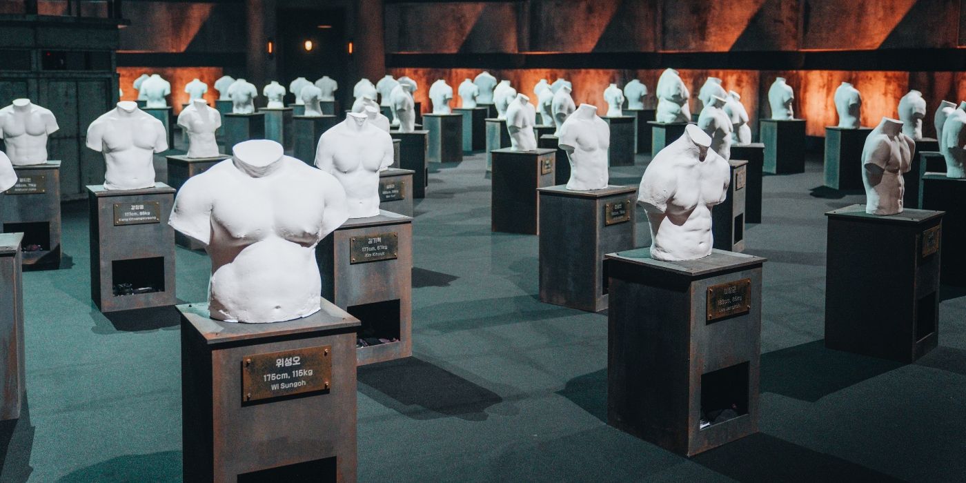 Physical 100 Season 2 busts sit on pedastals on the set.