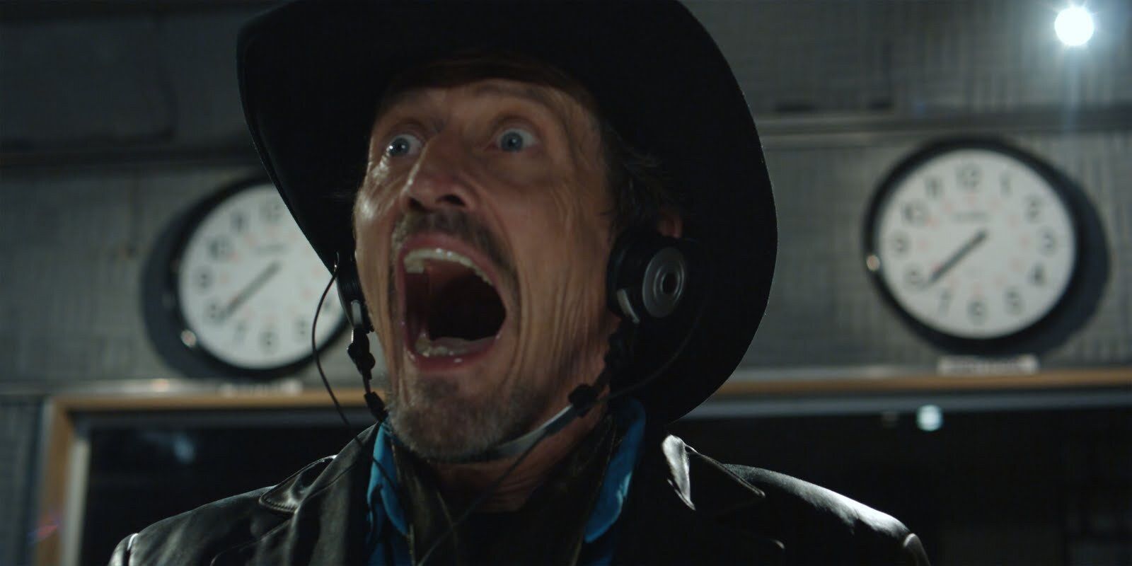 A still from Pontypool featuring Stephen McHattie as Grant Mazzy screaming while in his radio station recording booth