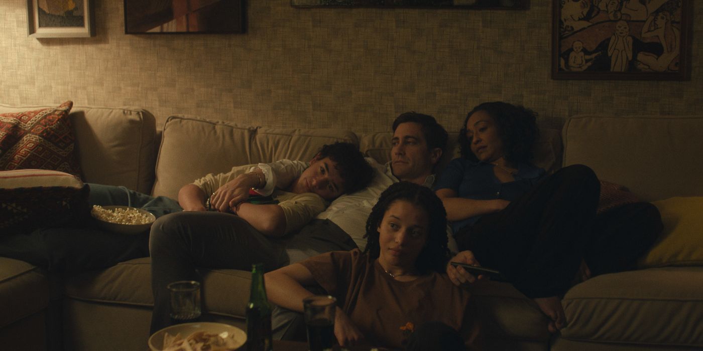 Jake Gyllenhaal and Ruth Negga sit on the couch with their family in 'Presumed Innocent'