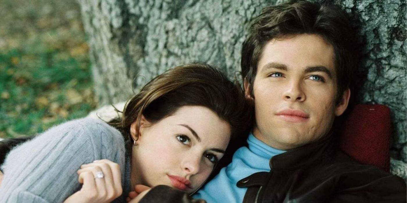 Anne Hathaway and Chris Pine cuddling against a tree in The Princess Diaries 2 
