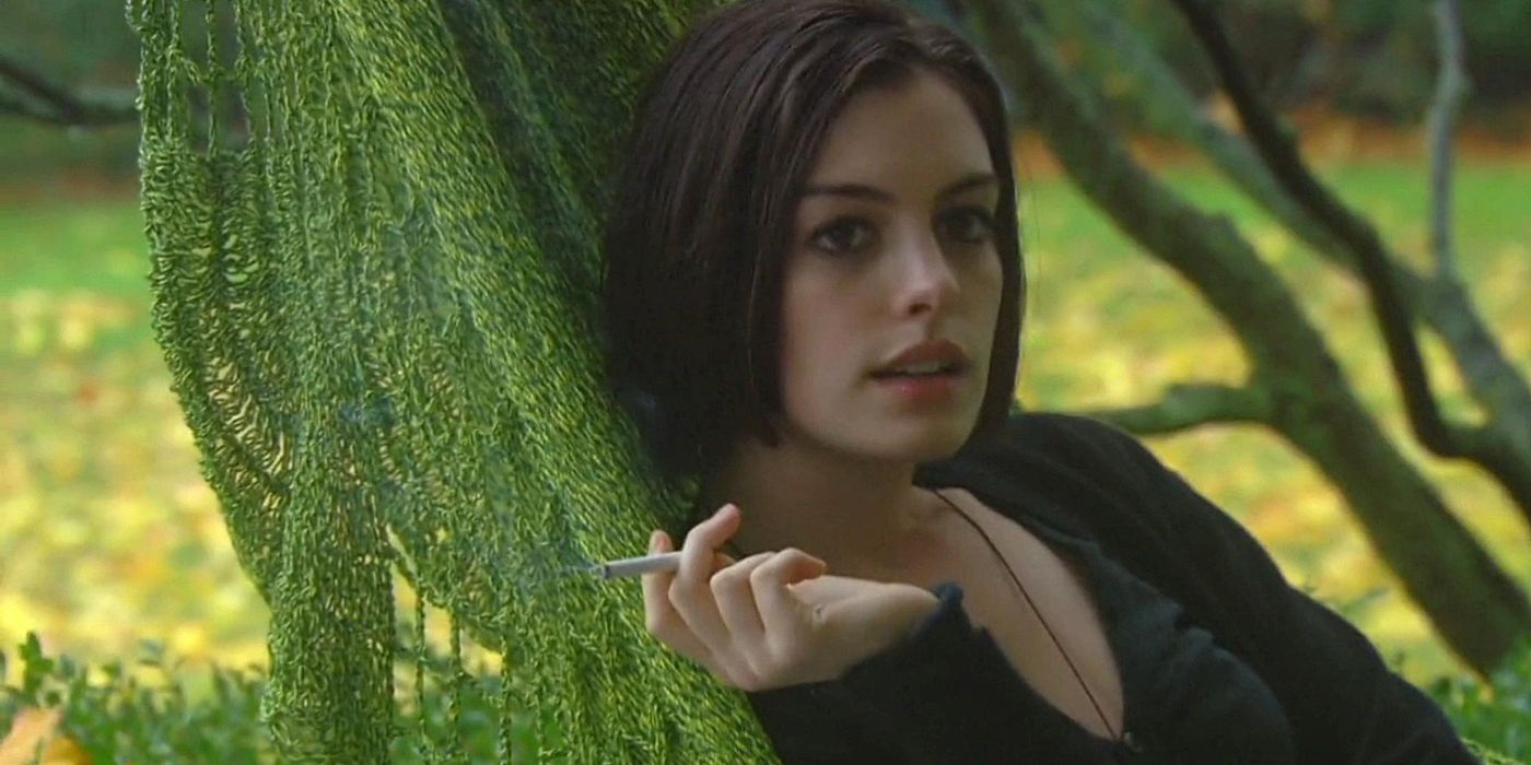 Anne Hathaway as Kym smoking against a tree in Rachel Getting Married