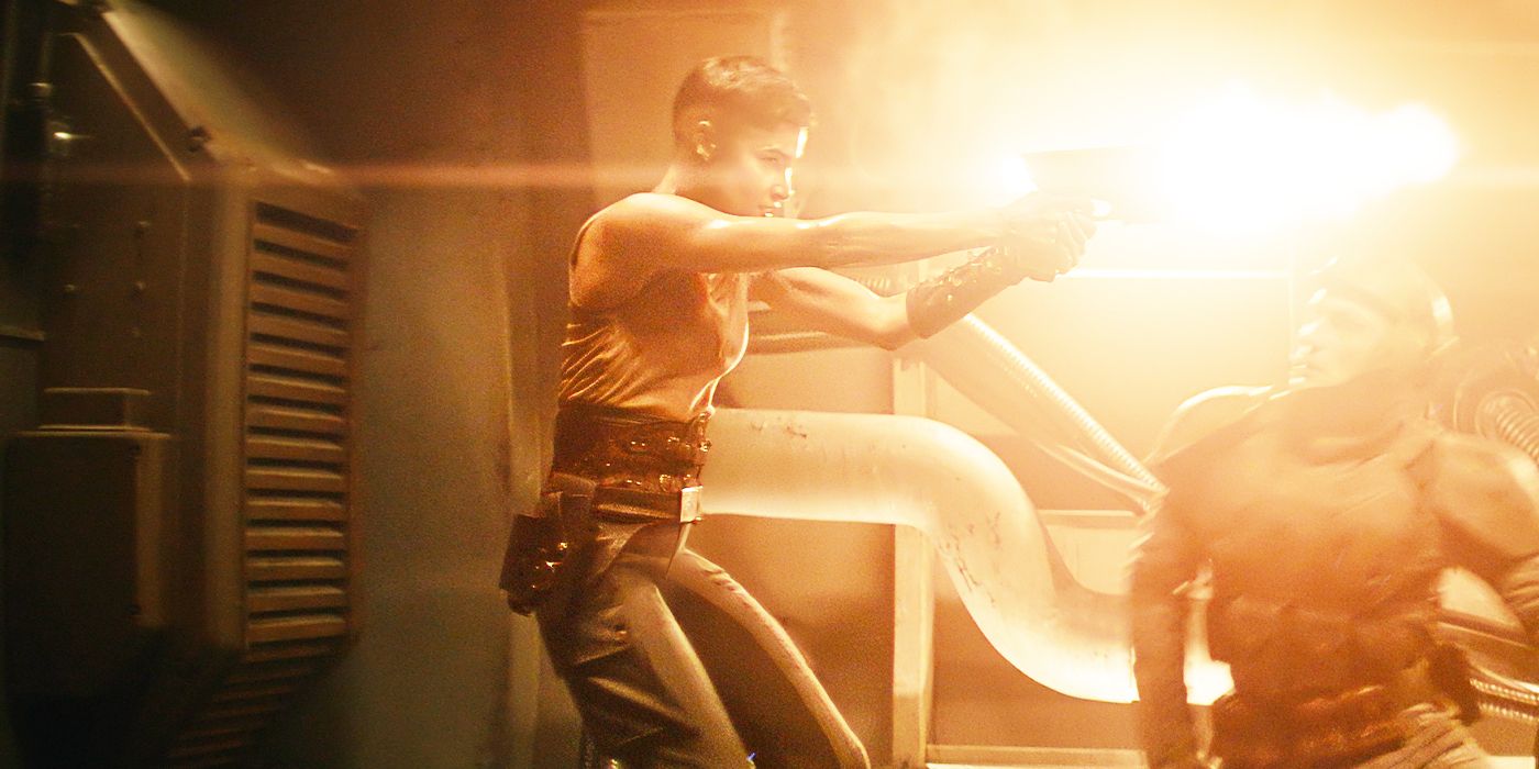 Sofia Boutella as Kora shooting down a hallway in Rebel Moon - Part Two: The Scargiver. 