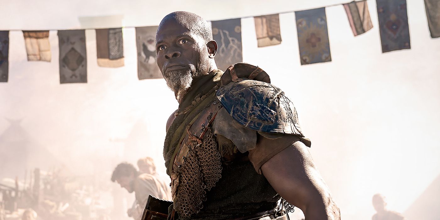 Djimon Hounsou as Titus looking at an unfolding battle in Rebel Moon - Part Two: The Scargiver. 