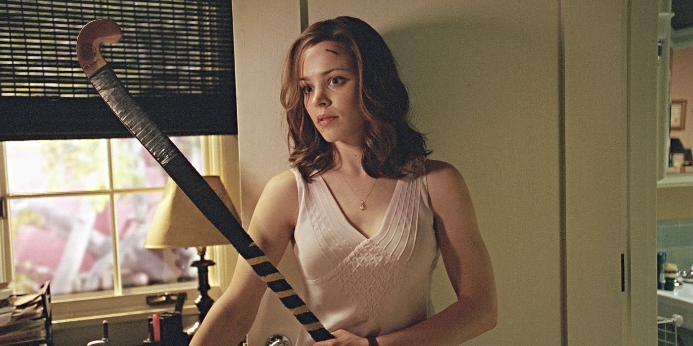 Rachel McAdams as Lisa, wielding a field hockey stick as she walks around a house with a cut on her head in Red Eye