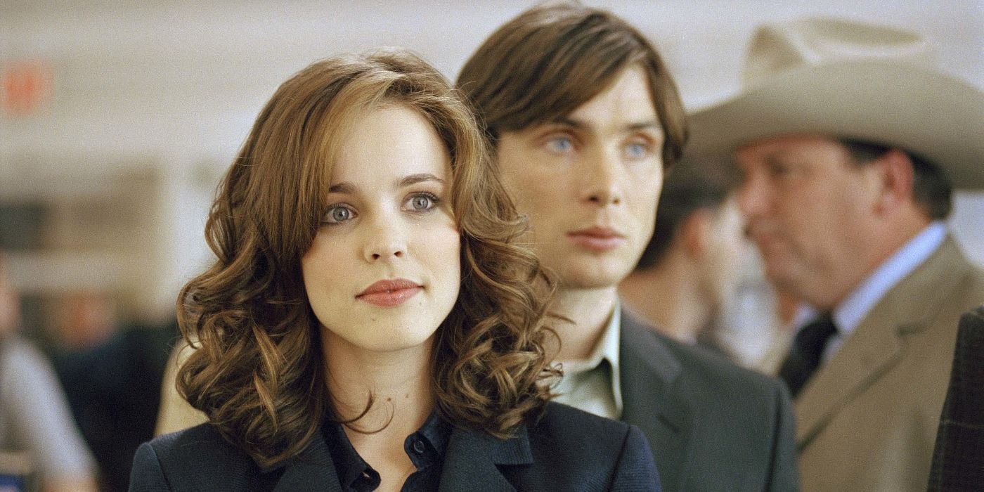 Rachel McAdams as Lisa, standing in an airport while Cillian Murphy as Jack Rippner stands behind her