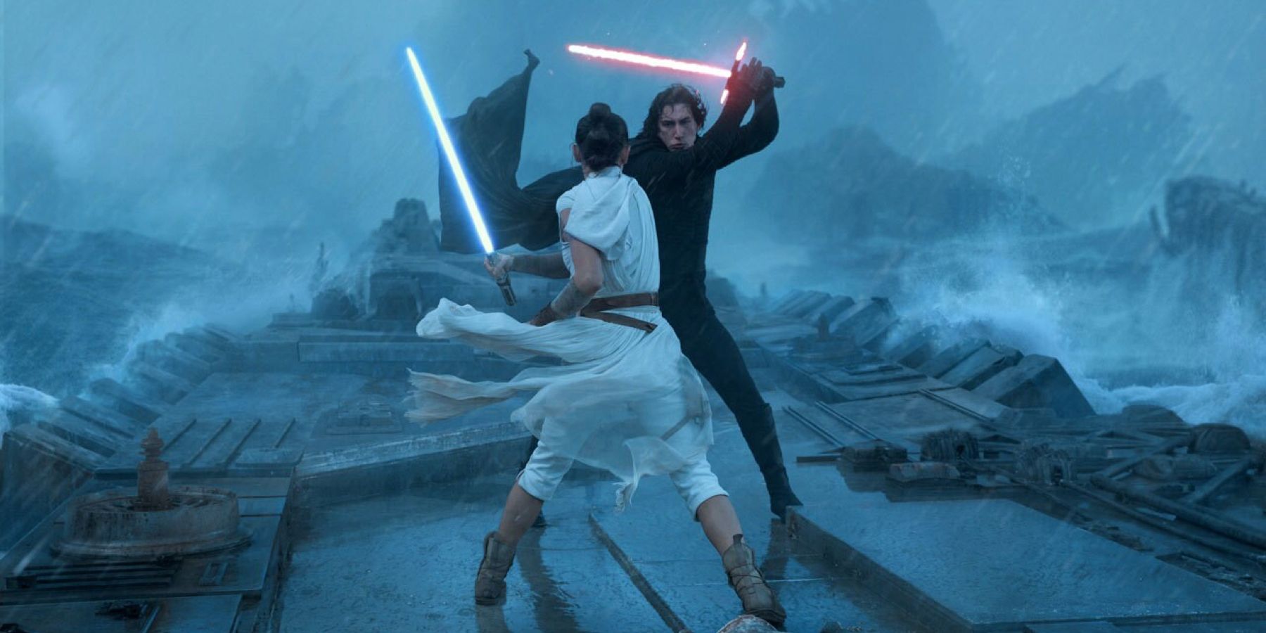 Rey, played by Actor Daisy Ridley, and Kylo Ren, played by Adam Driver, battle ferociously with blue and red lightsabers on the wreckage of the Death Star II in 'Star Wars: The Rise of Skywalker'