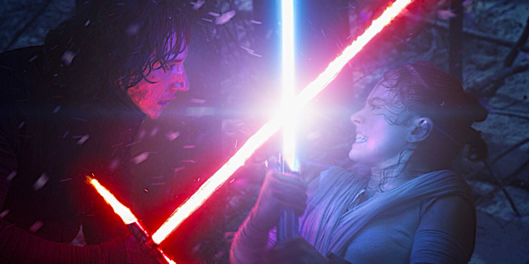 Kylo Ren, played by Actor Adam Driver, and Rey, played by Actor Daisy Ridley, grit their teeth during an intense lightsaber battle in 'Star Wars: The Force Awakens'