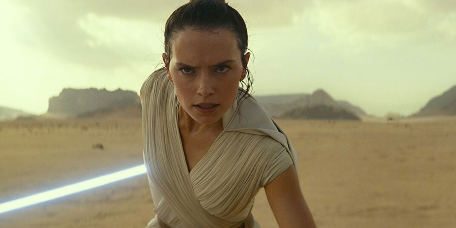 Determined Jedi Rey prepares to vault over an advancing TIE fighter in the desert of Pasaana in 'Star Wars: The Rise of Skywalker'