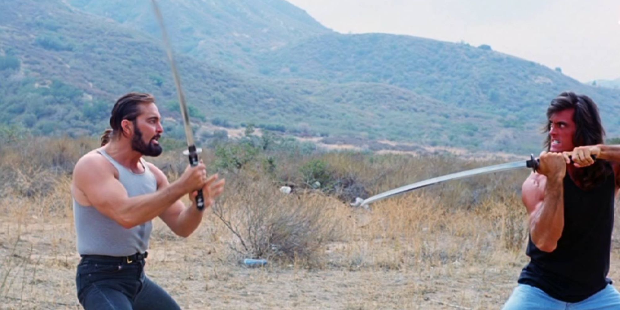 Robert Z'Dar and Matt Hannon duel with swords in the desert in Samurai Cop (1991)