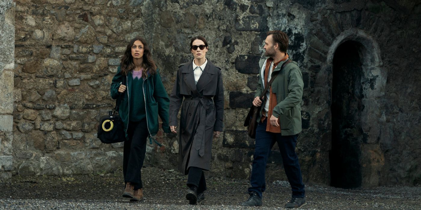 Robyn Cara, Siobhán Cullen in sunglasses, and Will Forte, walking casually by a stone wall.