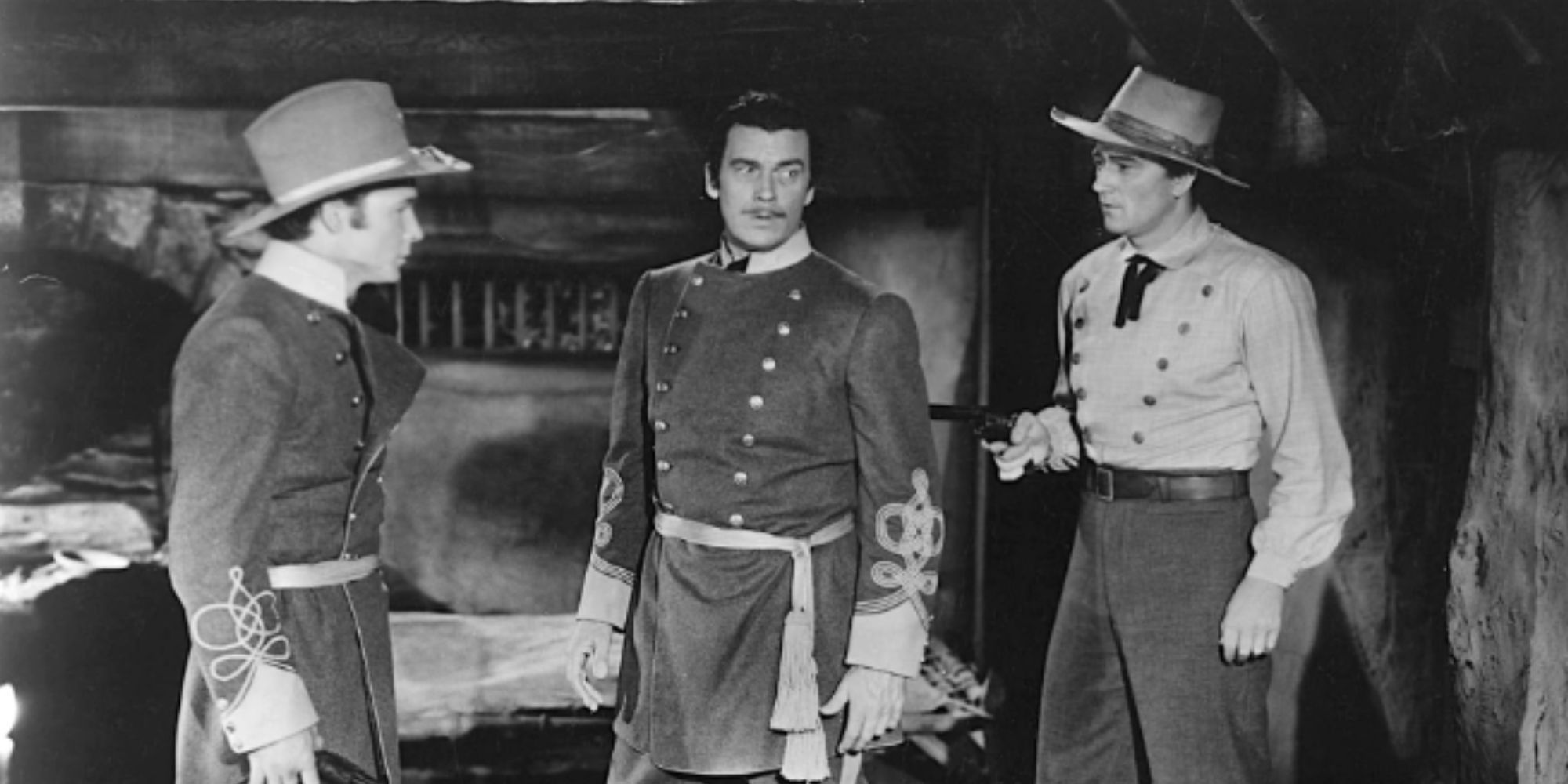 Roy Rogers, Walter Pidgeon and John Wayne standing next to each other in Dark Command (1940)