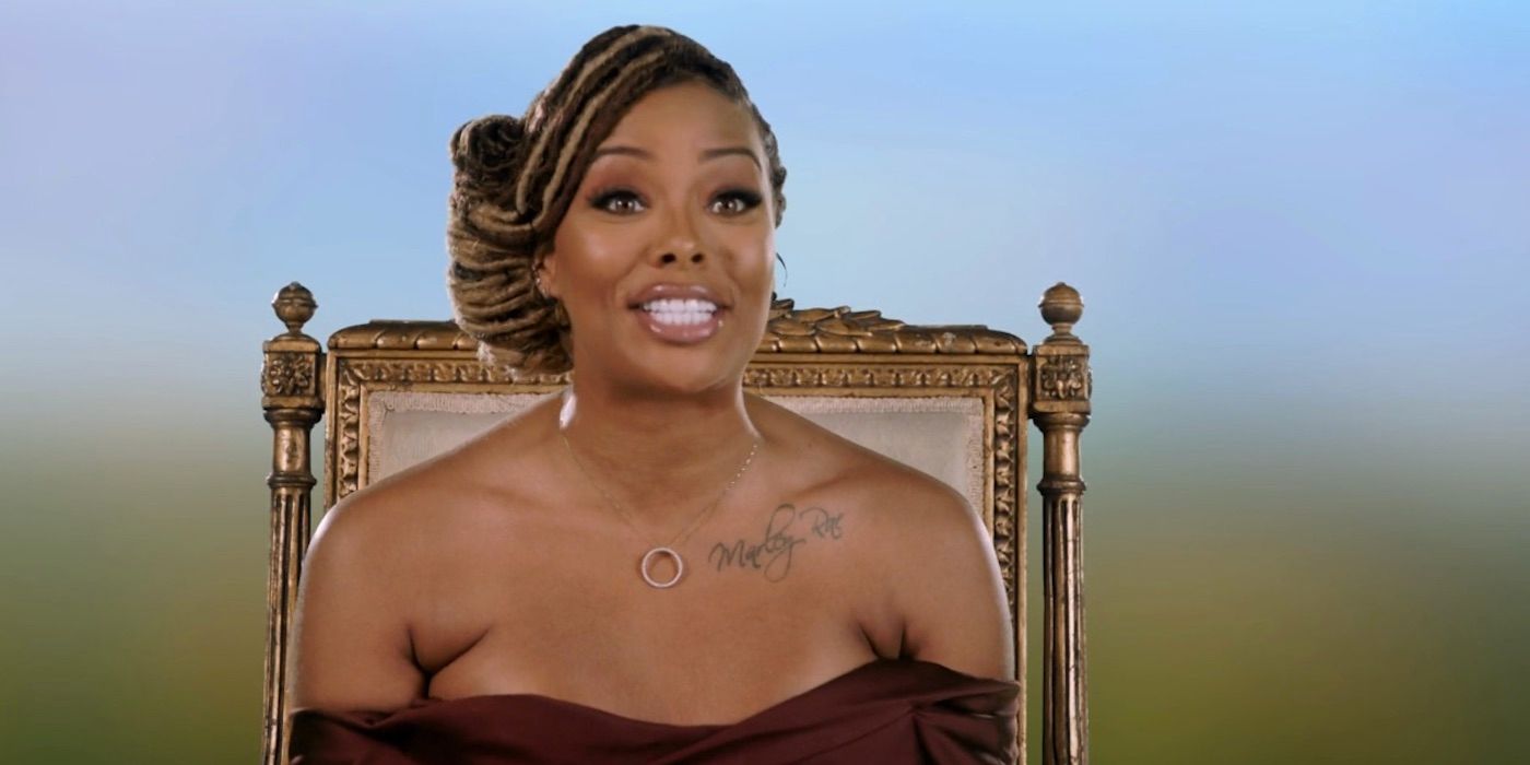 Eva Marcille confessional look with an upswept side braid hairstyle, on 'Real Housewives Ultimate Girl Trip'