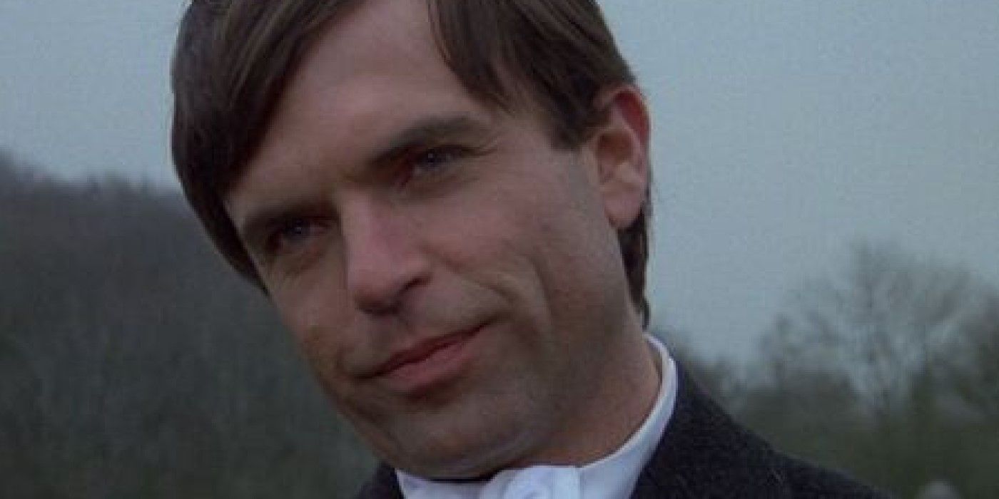 Close-up of a grown Damien (Sam Neill) with a smirk in 'Omen III: The Final Conflict'