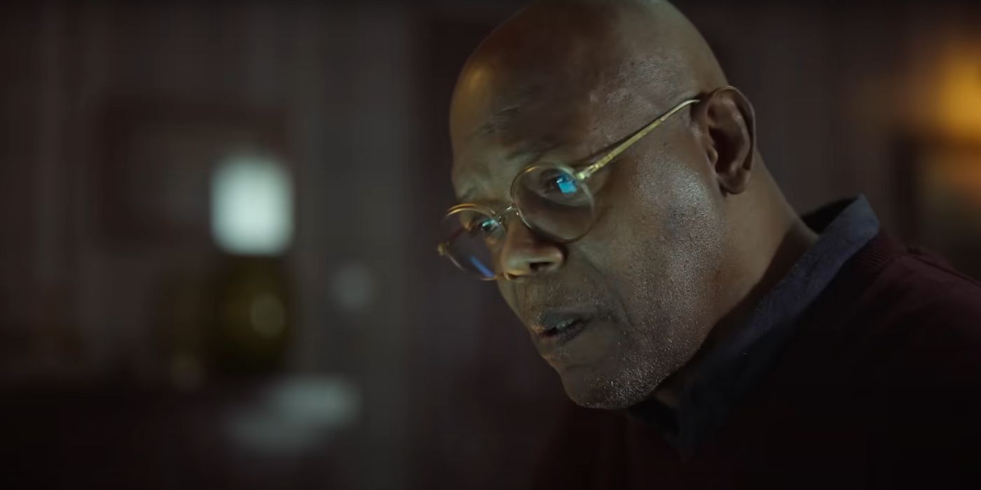 Samuel L. Jackson looking down at something in Damaged.