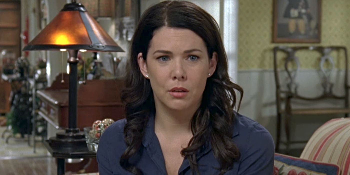 Lauren Graham as Lorelai Gilmore, sitting on her couch looking stunned in the Gilmore Girls episode, 