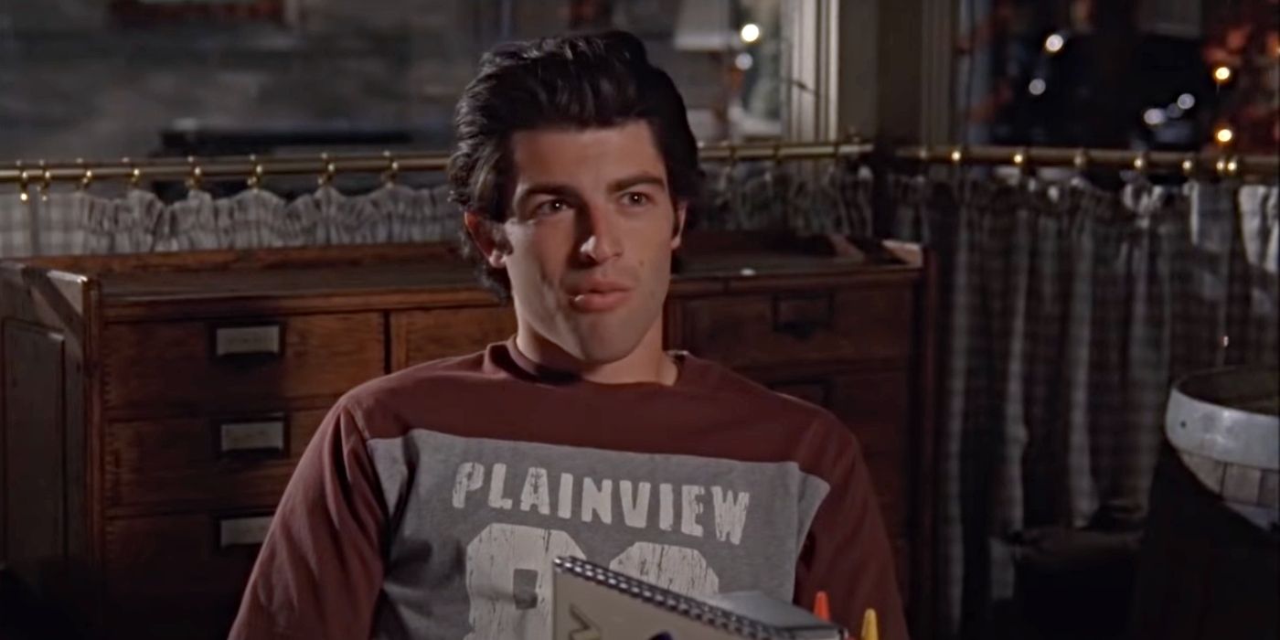 Max Greenfield as Lucas, sitting at a table in Luke's Diner in the Gilmore Girls episode "Chicken or Beef?"