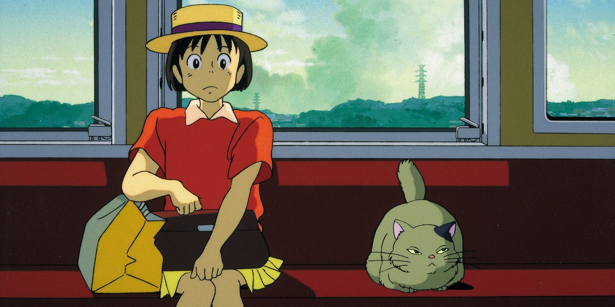 Shizuku and a cat on the train in &lsquo;Whisper of the Heart&rsquo;.