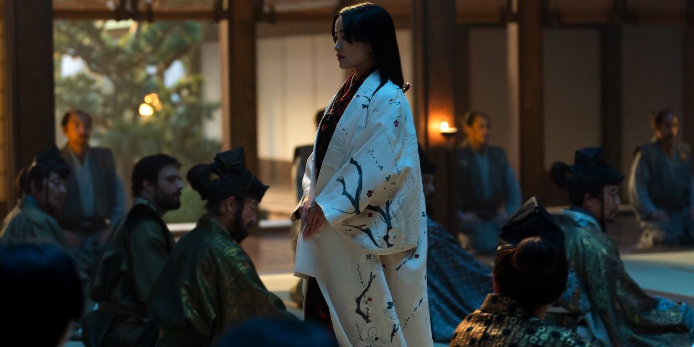 Anna Sawai walking among rows of seated vassals in Shogun Episode 9