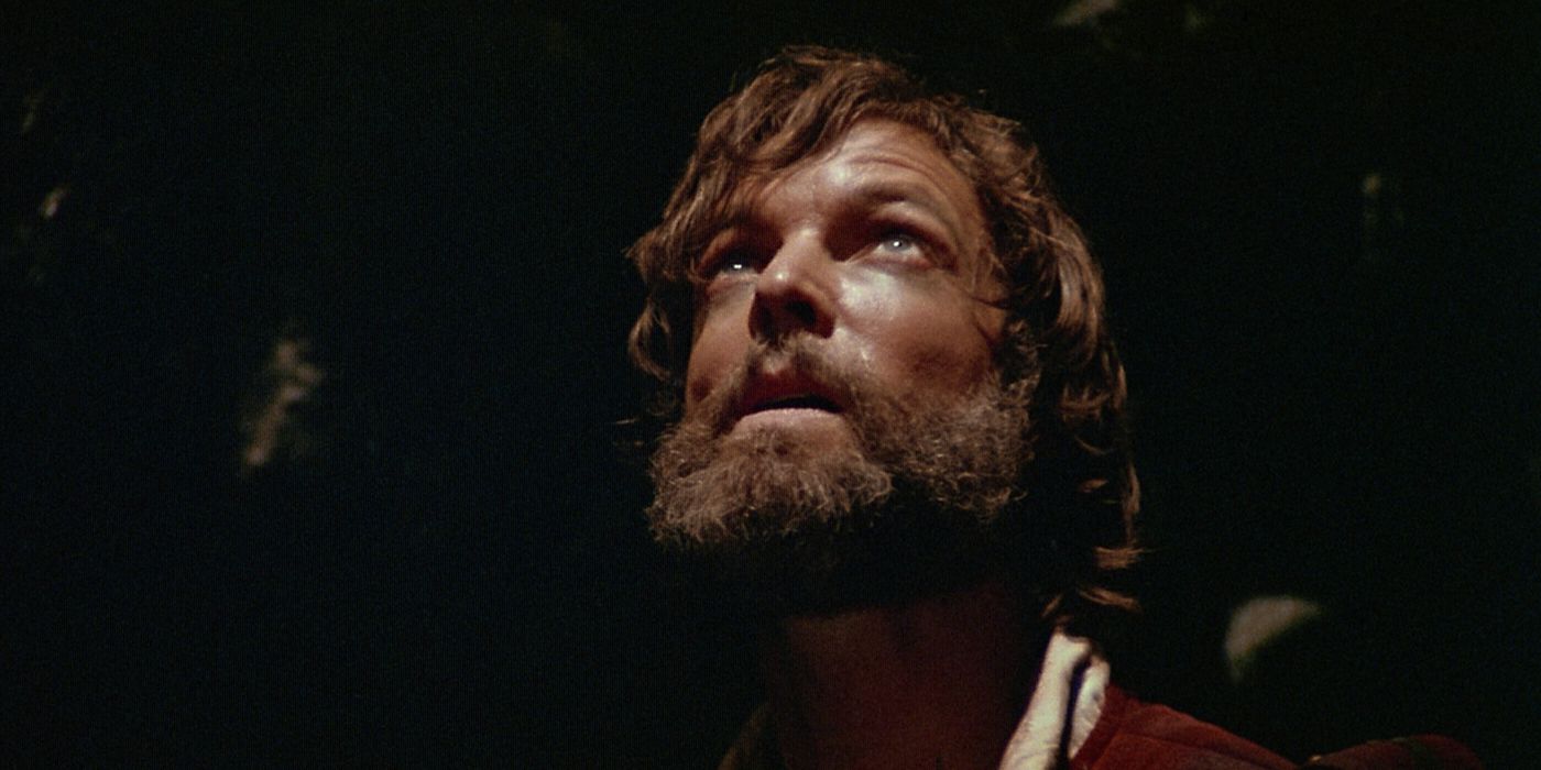 John Blackthorne (Richard Chamberlain) looking up from inside a dark hole in the ground in the 1980 Shogun