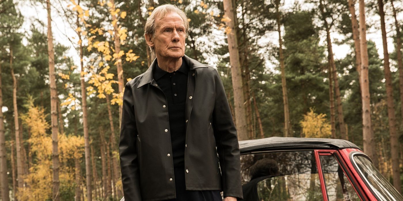 Bill Nighy standing in the woods in Sometimes Always Never