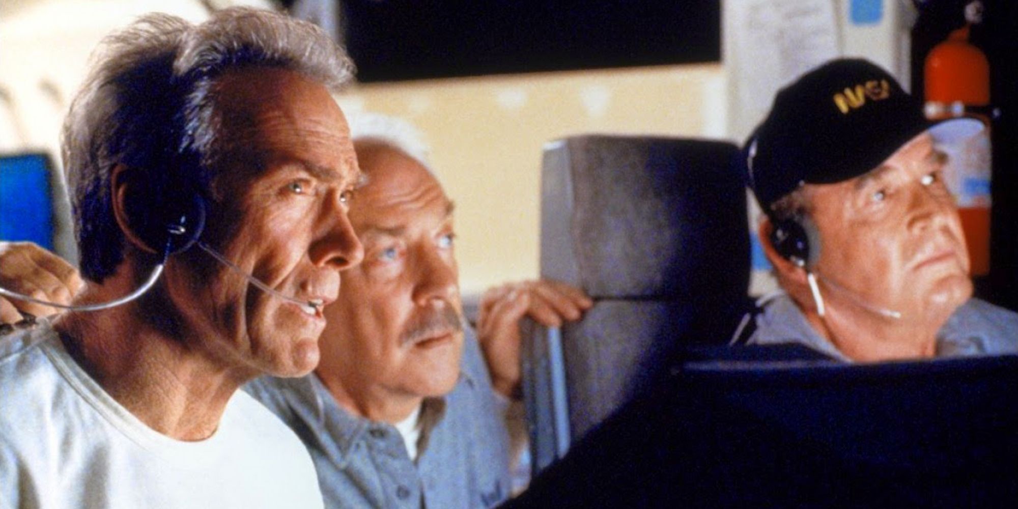 Frank, Jerry, and Tank looking intently ahead in Space Cowboys