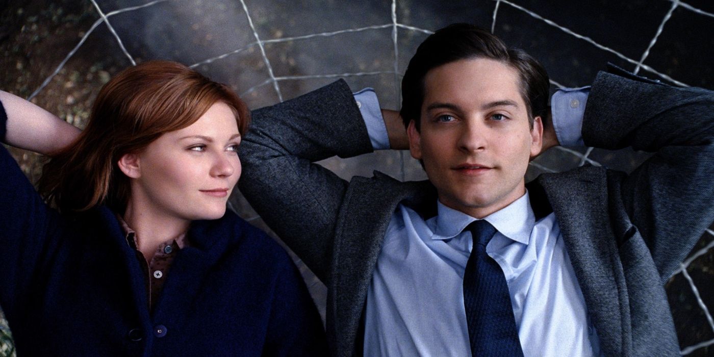 Tobey Maguire as Peter Parker and Kirsten as Mary Jane smiling and laying in a web in Spider-Man 3