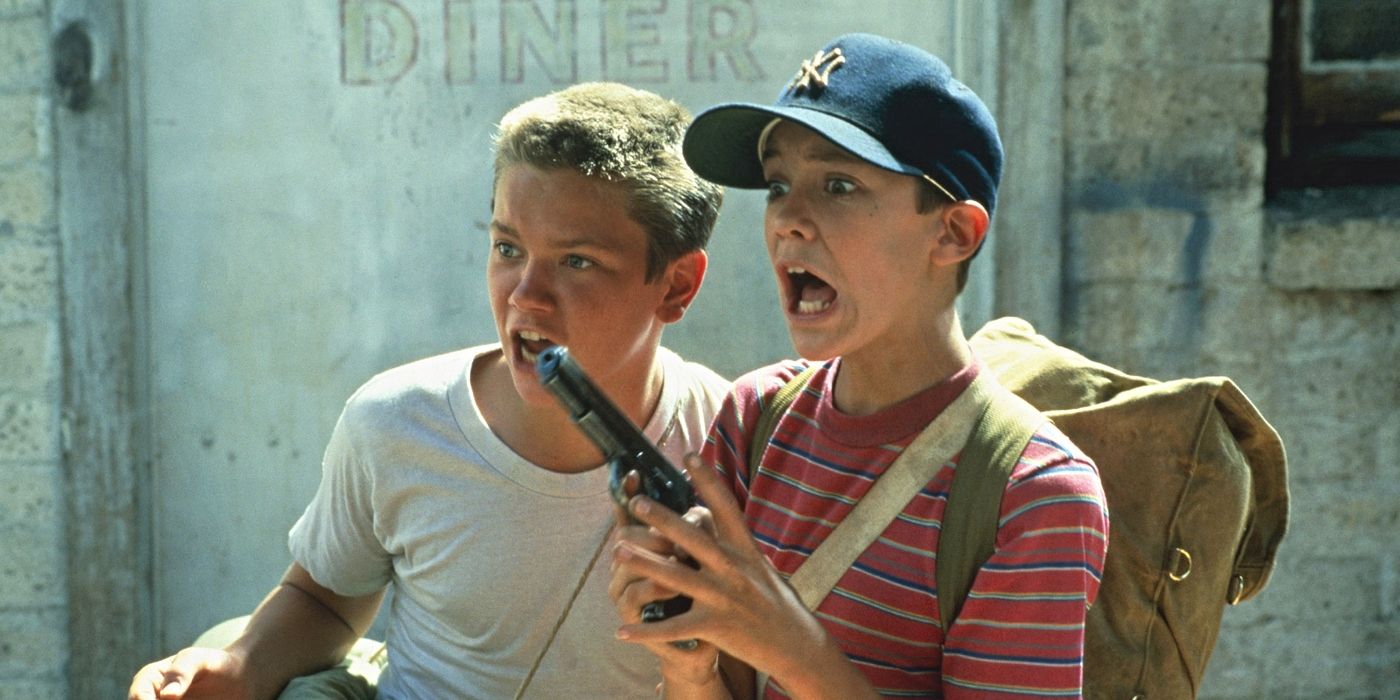 Wil Wheaton and River Phoenix as Gordie Lachance and Chris Chambers, screaming while Gordie holds a gun in Stand by Me