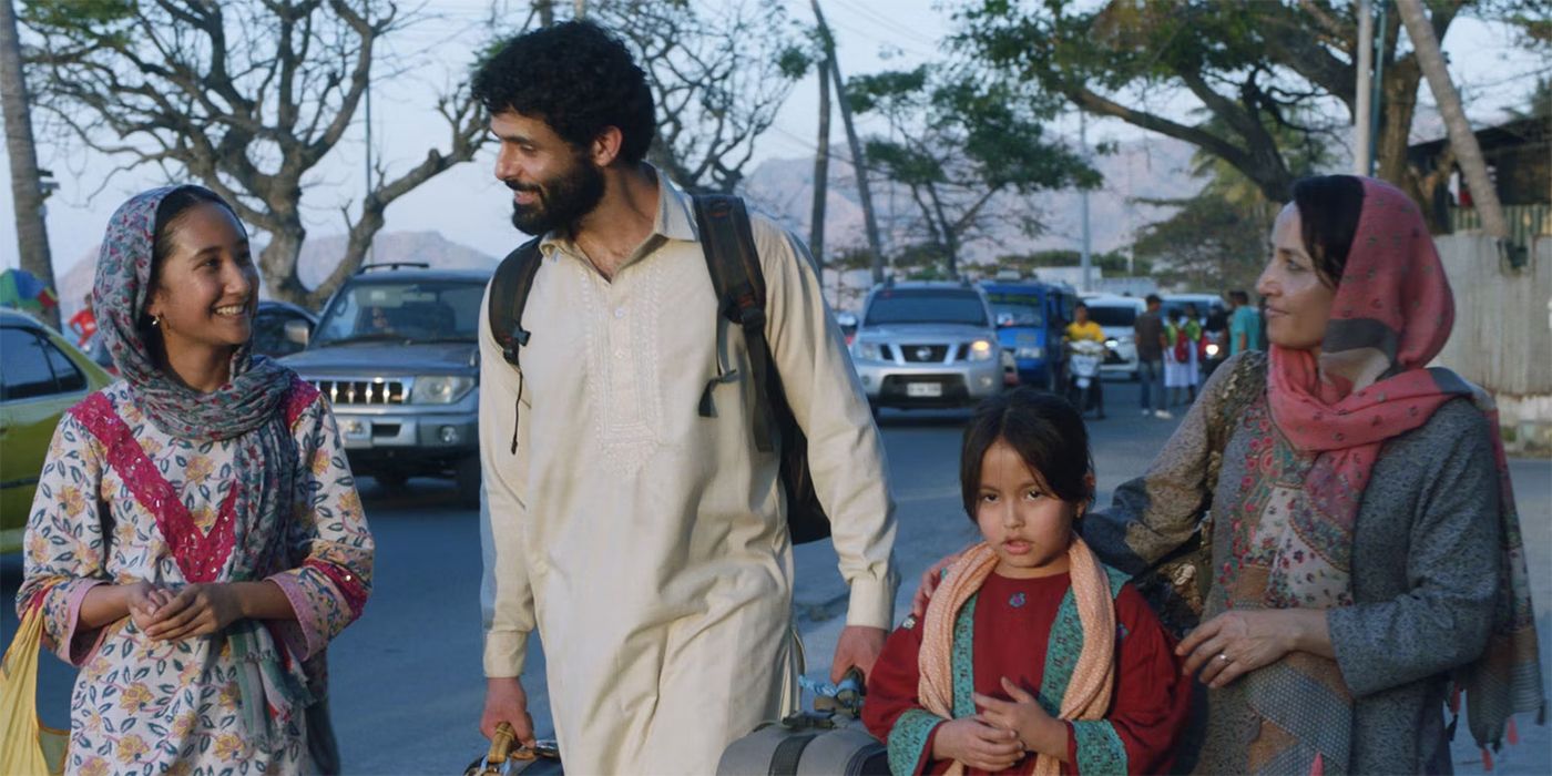 Fayssal Bazzi walking with a girl and two women in Stateless