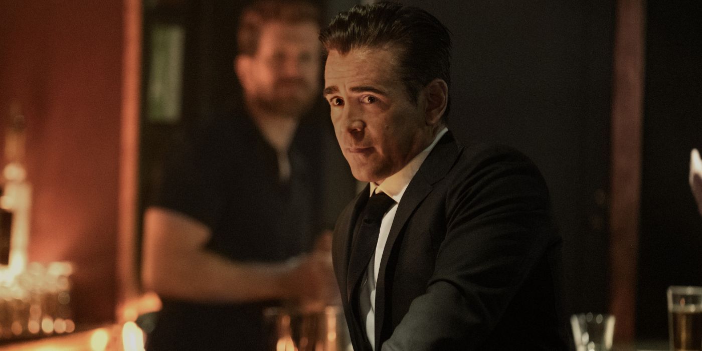 Colin Farrell as John Sugar wearing a suit at a bar.