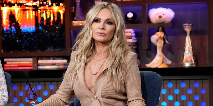 Tamra Judge sits in a beige sweater looking serious on Watch What Happens Live